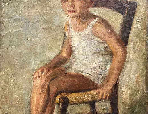 Portrait d'un jeune garçon assis sur une chaise 